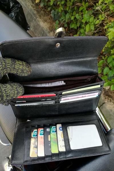 海口环卫女工捡到钱包,手机热心归还失主