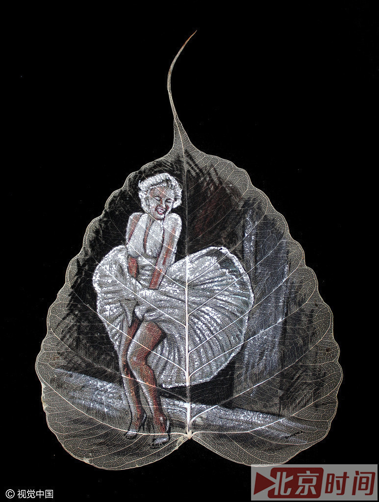 印度艺术家树叶上画名人肖像 惟妙惟肖技艺精湛
